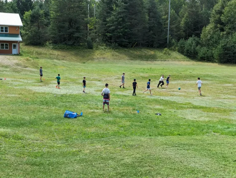 Kids-playing-soccer-at-camp-chai