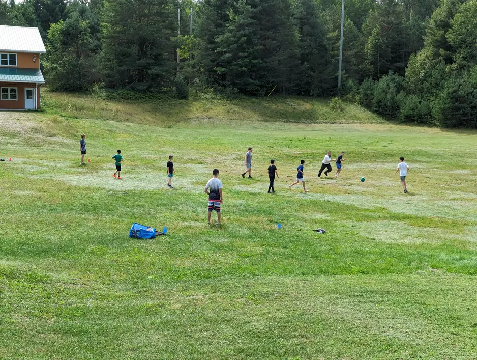 Kids playing sports at camp chai